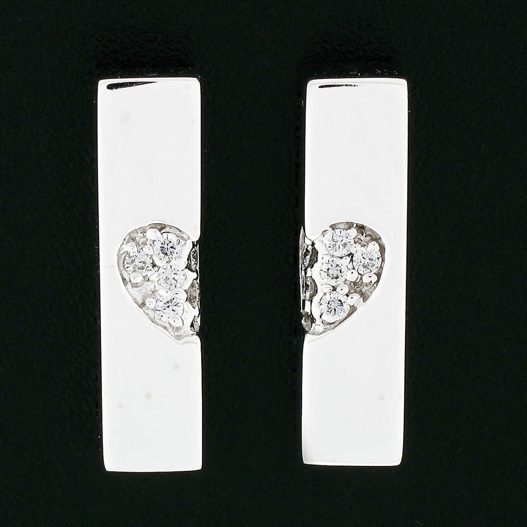 Movado 18k White Gold 0.15 ctw Pave Set Round Diamond Wrapped Heart Bar Earrings
