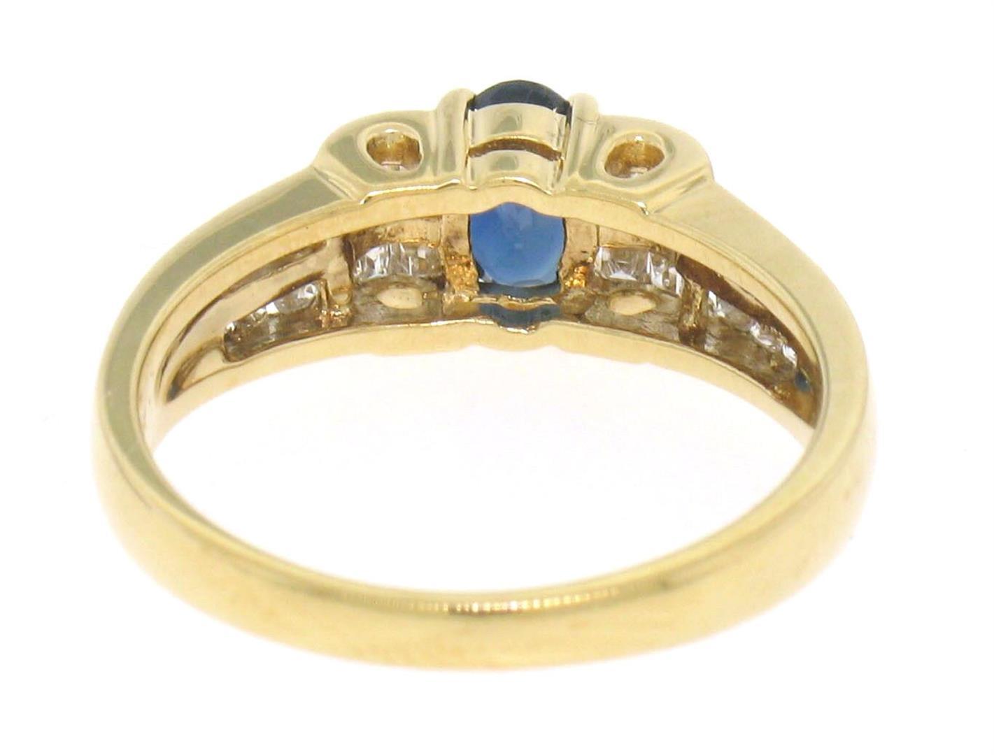 18k Yellow Gold .94 ctw Solitaire Oval Sapphire w/ Baguette & Round Diamond Ring