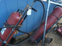 Two fire extinguishers large pull cart ones