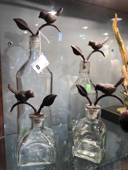 4 Decorative Bottles w/ Cast Iron Bird Stoppers