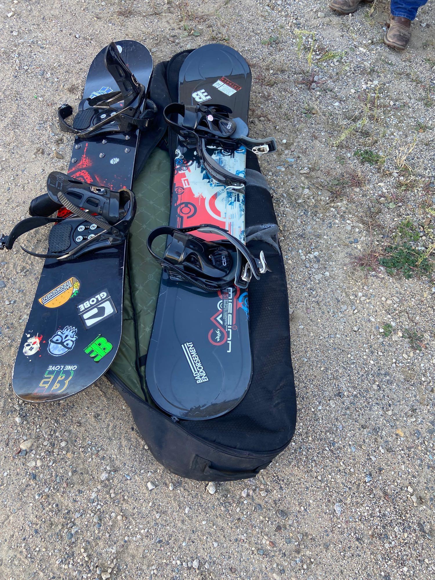 Two snowboards and travel bag