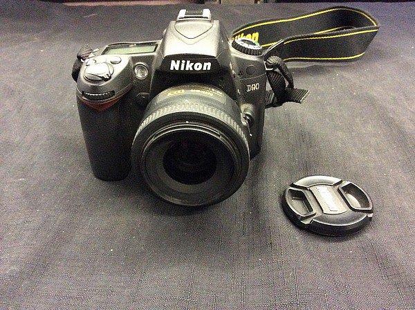 Nikon D90 digital camera with battery and nikon dx 35mm lens