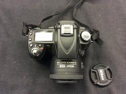 Nikon D90 digital camera with battery and nikon dx 35mm lens