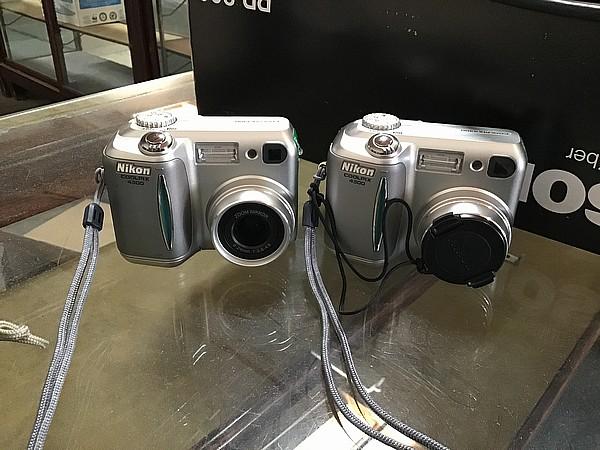 Two Nikon colorpix cameras