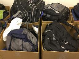 12 boxes of backpacks,clothes,purses,tools,electronics, Phone chargers and plugs,canes,