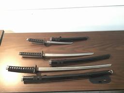 Three black samurai swords