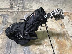 Legacy titleist golf bag with misc golf clubs