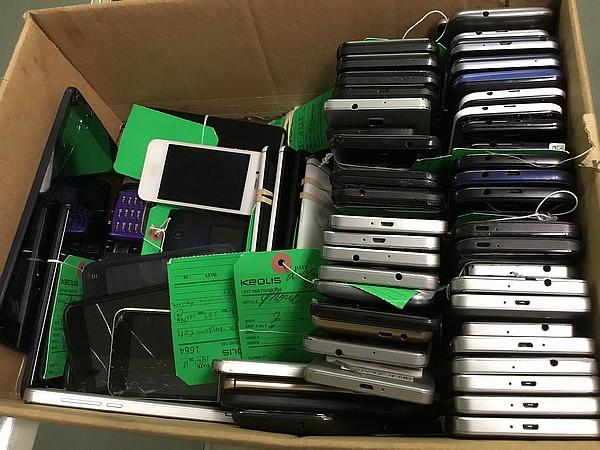 Box of cellphones Possibly locked, no chargers, some damage