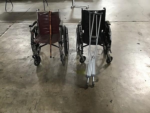 Two wheelchairs with crutches and cane