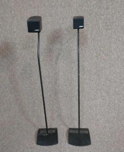 Two Bose cube speakers with stands