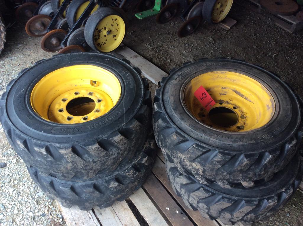 10-16.5 NHS skid loader tires mounted on 10-hole rims. (4 TIMES THE MONEY)