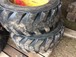 10-16.5 NHS skid loader tires mounted on 10-hole rims. (4 TIMES THE MONEY)