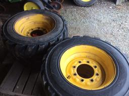 10-16.5 NHS skid loader tires mounted on 10-hole rims. (4 TIMES THE MONEY)