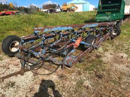 Melroe 7-bottom 18in on land hitch trailer plow w/ spring cushion coulters.