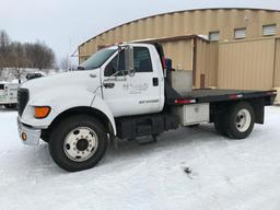 2003 Ford F-650 XLT flatbed truck; single axle; Cummins 5.9L diesel engine; manual trans; 12ft steel