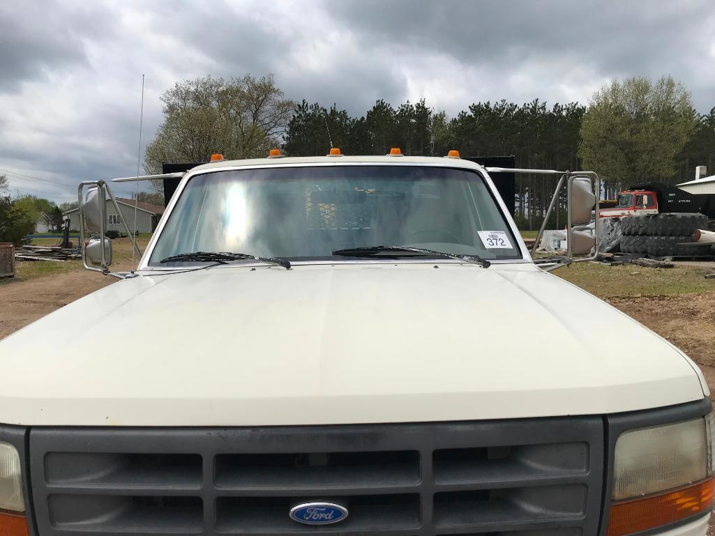 (TITLE) 1994 Ford Super Duty flatbed truck; 2x4; 7.3L diesel engine; auto; DRW; 14ft stake rack;