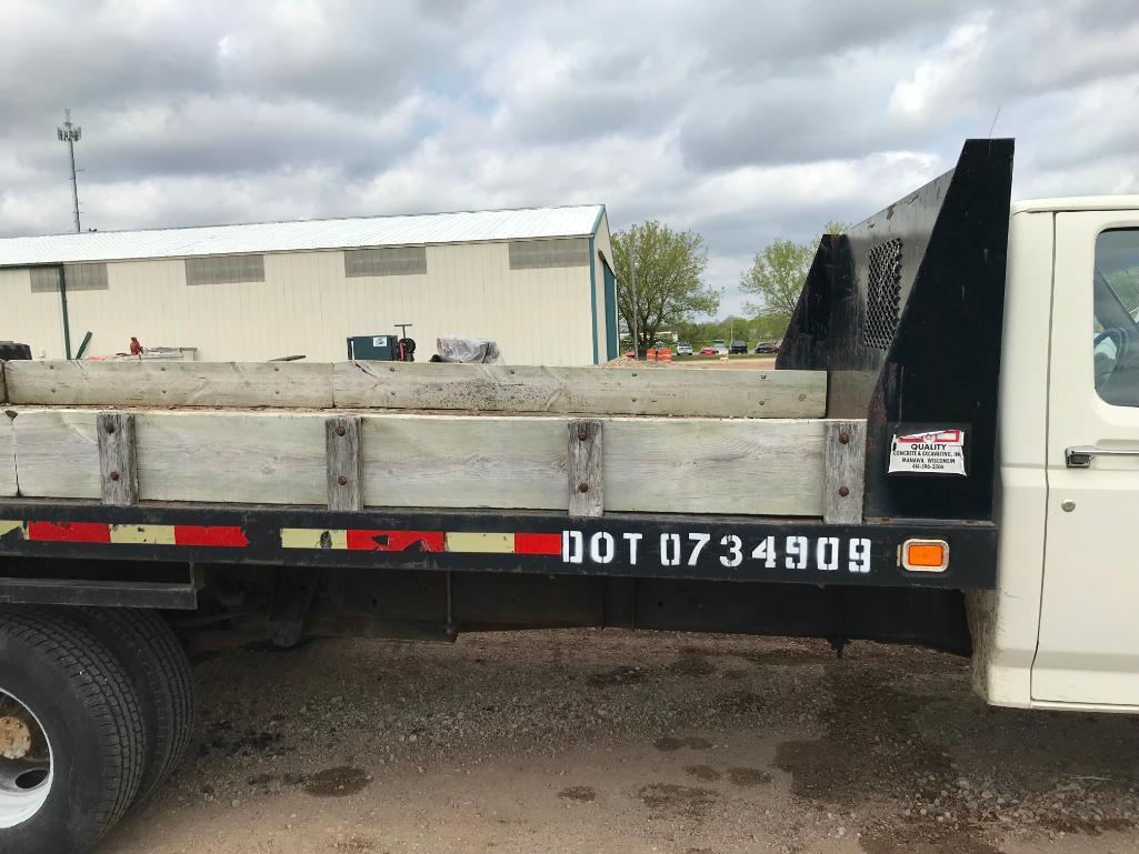 (TITLE) 1994 Ford Super Duty flatbed truck; 2x4; 7.3L diesel engine; auto; DRW; 14ft stake rack;