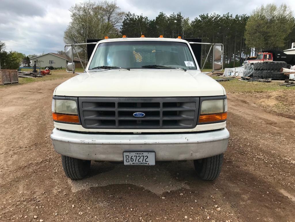 (TITLE) 1994 Ford Super Duty flatbed truck; 2x4; 7.3L diesel engine; auto; DRW; 14ft stake rack;