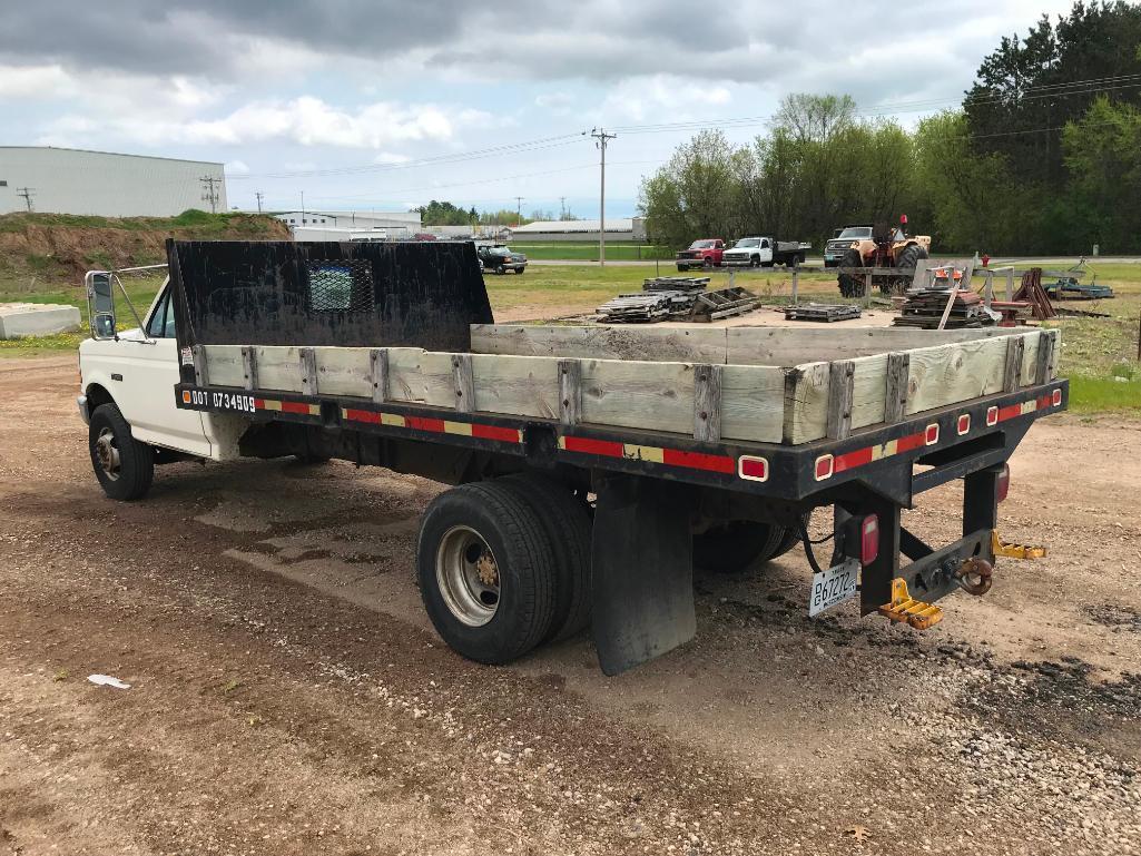 (TITLE) 1994 Ford Super Duty flatbed truck; 2x4; 7.3L diesel engine; auto; DRW; 14ft stake rack;