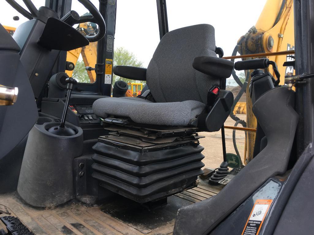 2006 John Deere 310SG tractor loader backhoe; cab w/ AC; ext hoe; powershift trans; ride control;