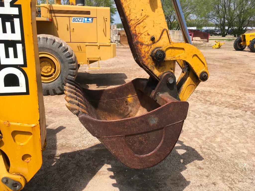 2006 John Deere 310SG tractor loader backhoe; cab w/ AC; ext hoe; powershift trans; ride control;