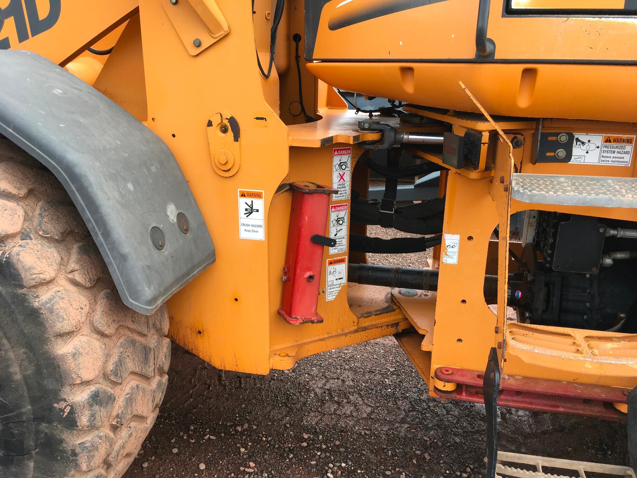 2004 Case 621D wheel loader; cab w/ AC; 20.5R25 tires; ACS quick coupler bucket; ride control; 7,957