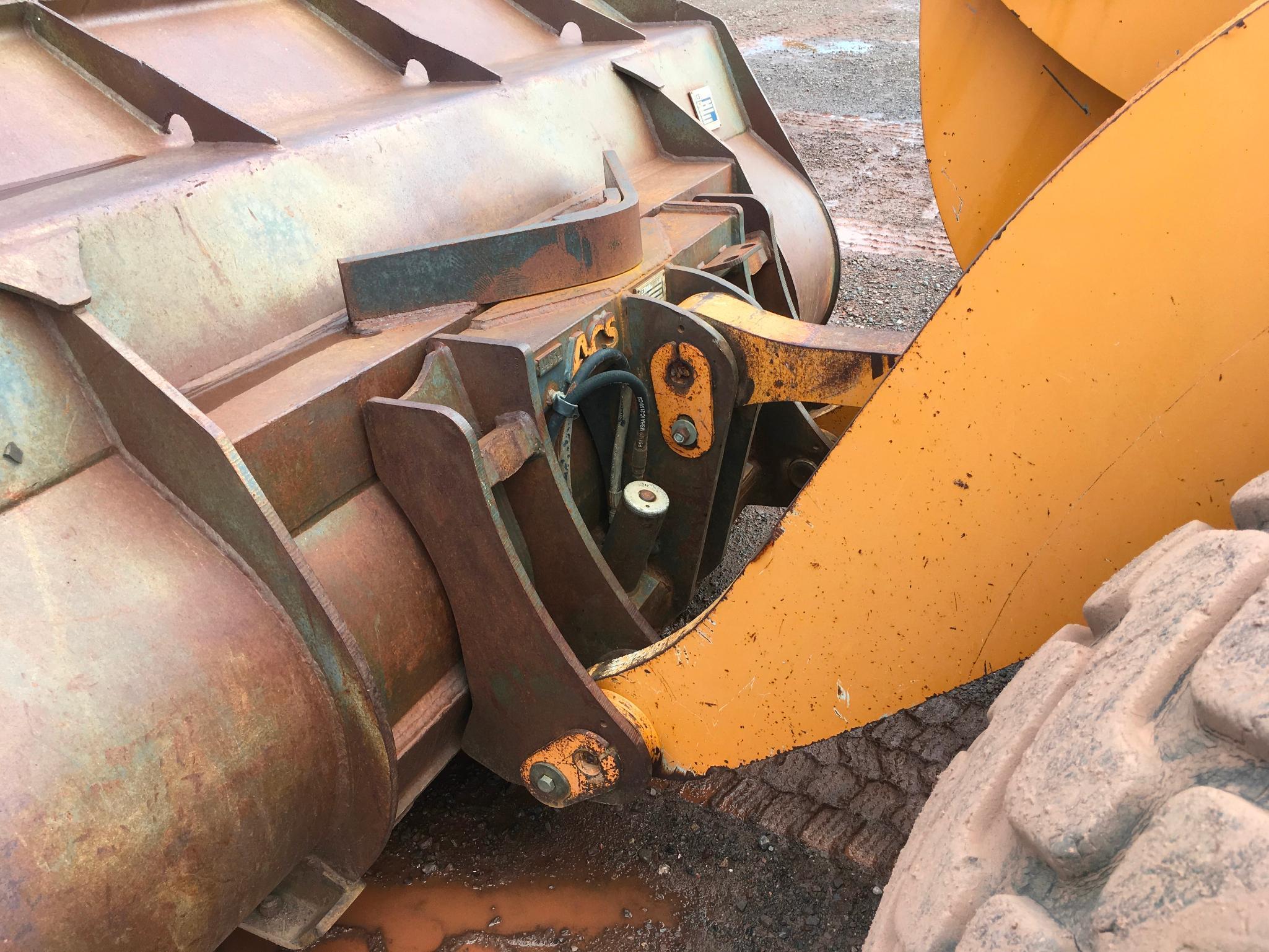 2004 Case 621D wheel loader; cab w/ AC; 20.5R25 tires; ACS quick coupler bucket; ride control; 7,957