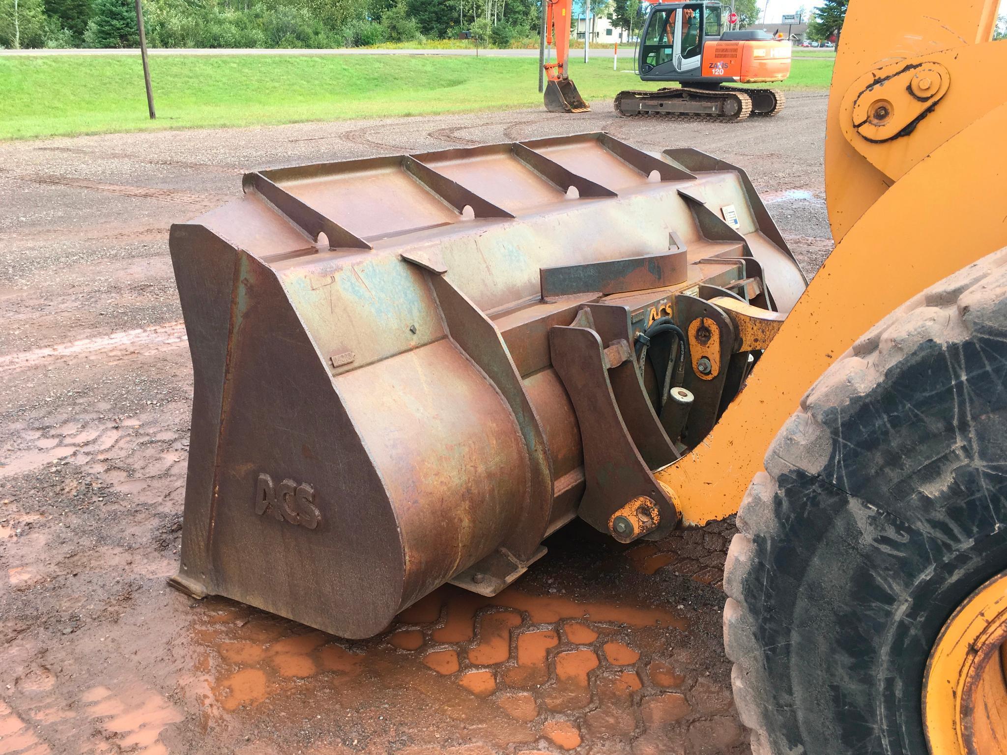 2004 Case 621D wheel loader; cab w/ AC; 20.5R25 tires; ACS quick coupler bucket; ride control; 7,957