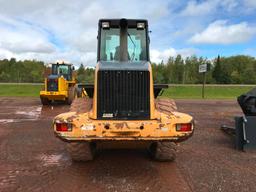 2004 Case 621D wheel loader; cab w/ AC; 20.5R25 tires; ACS quick coupler bucket; ride control; 7,957