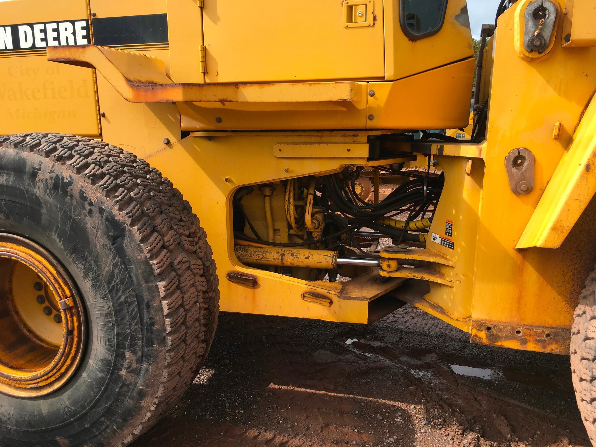 1997 John Deere 644G wheel loader; cab w/ heat; 23.5R x 25 radial tires; 3 yard ACS quick coupler