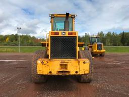 1997 John Deere 644G wheel loader; cab w/ heat; 23.5R x 25 radial tires; 3 yard ACS quick coupler