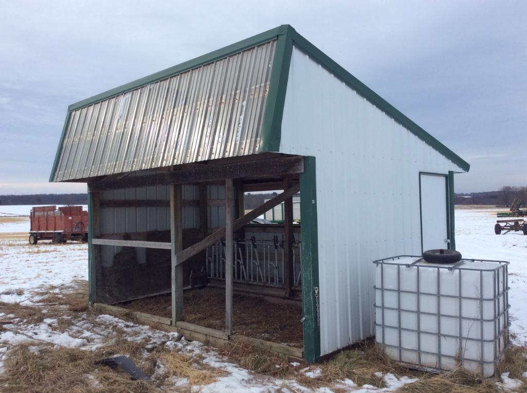 11' x 16' portable calf feeding shed w/ 10-head locks & feed alley.