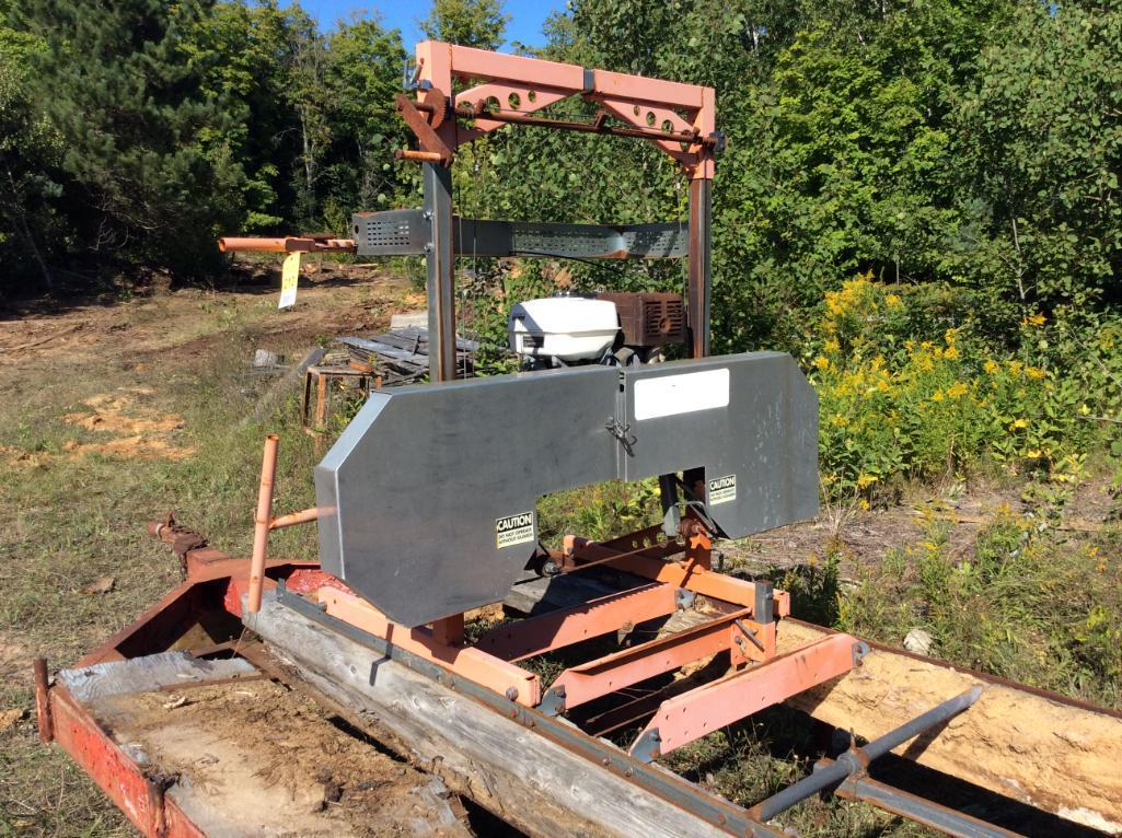 Lumberlite portable band saw mill w/ Honda 13 hp. gas engine; on trailer.