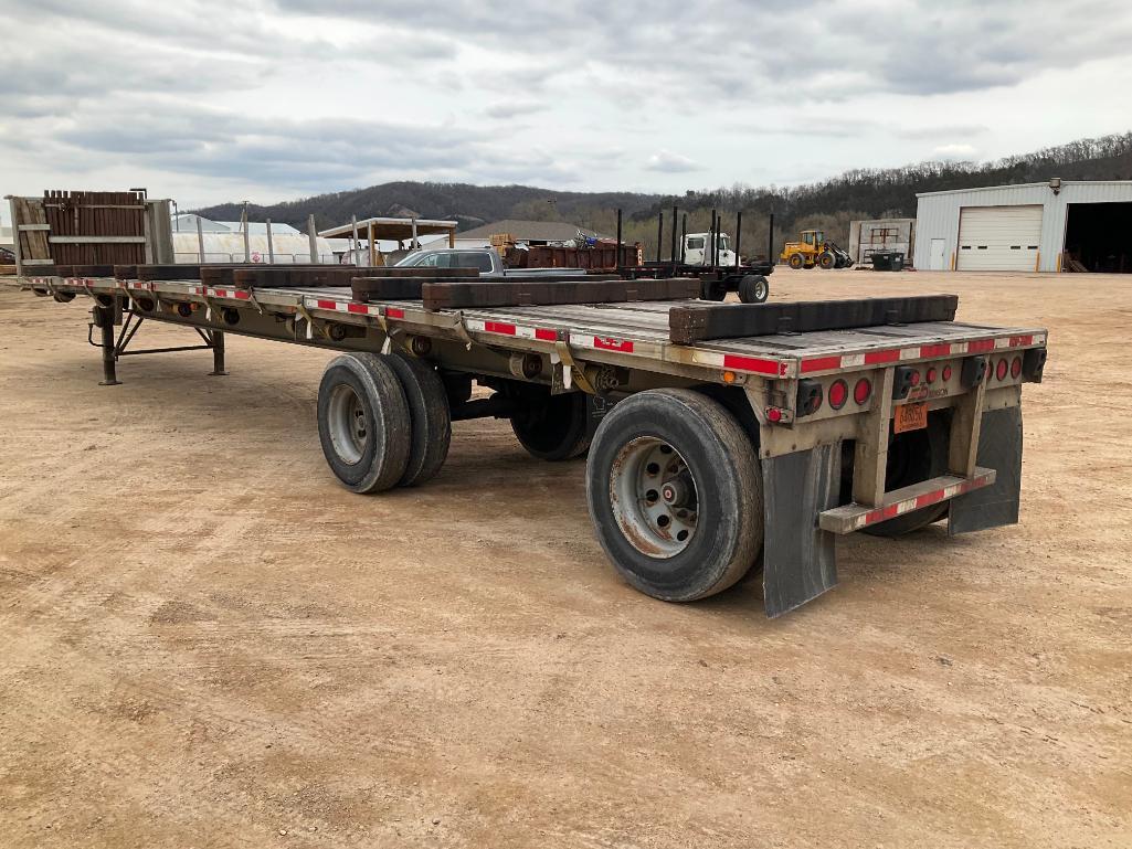 (TITLE) 1999 Benson 48' x 96" aluminum 10' spread axle flatbed trailer, air ride; bunks and