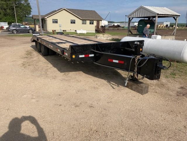 (TITLE) 1992 Interstate tandem axle tag trailer; 102" wide, 21' deck, 5' beavertail & ramps, pintle