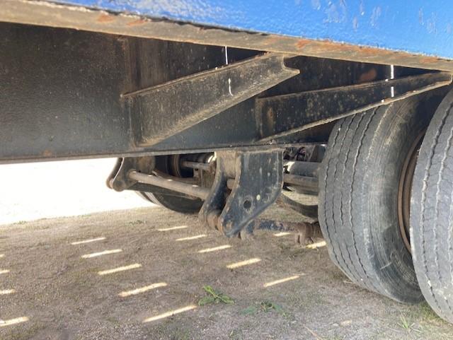 (TITLE) 1992 Interstate tandem axle tag trailer; 102" wide, 21' deck, 5' beavertail & ramps, pintle