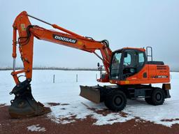 2013 Doosan DX190W-3 wheel excavator, cab w/AC, 7'7" stick, front blade, 10.00x20 tires, 36" quick