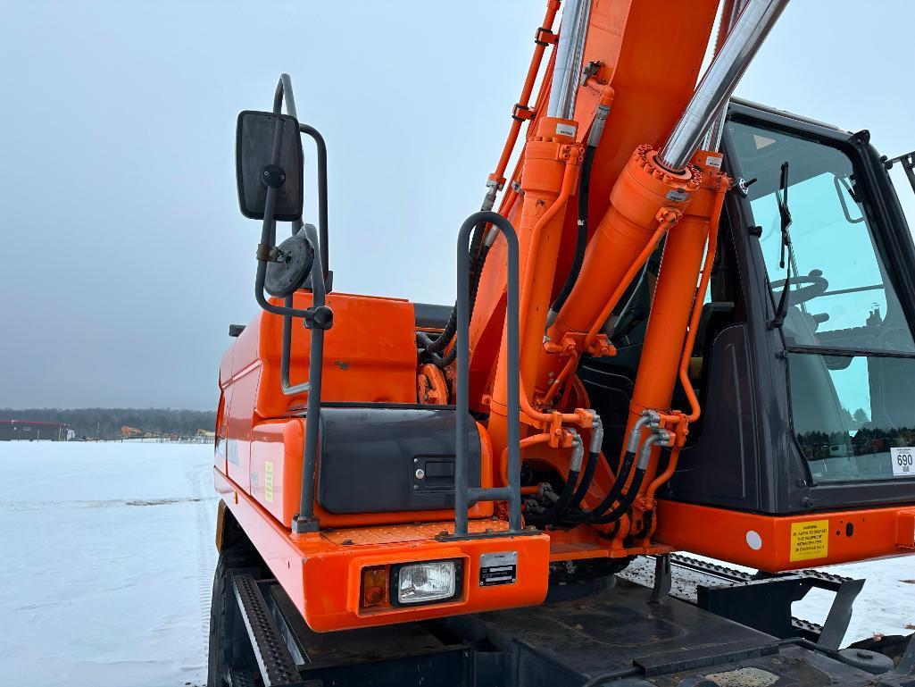 2013 Doosan DX190W-3 wheel excavator, cab w/AC, 7'7" stick, front blade, 10.00x20 tires, 36" quick