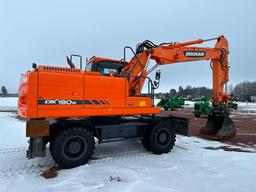 2013 Doosan DX190W-3 wheel excavator, cab w/AC, 7'7" stick, front blade, 10.00x20 tires, 36" quick