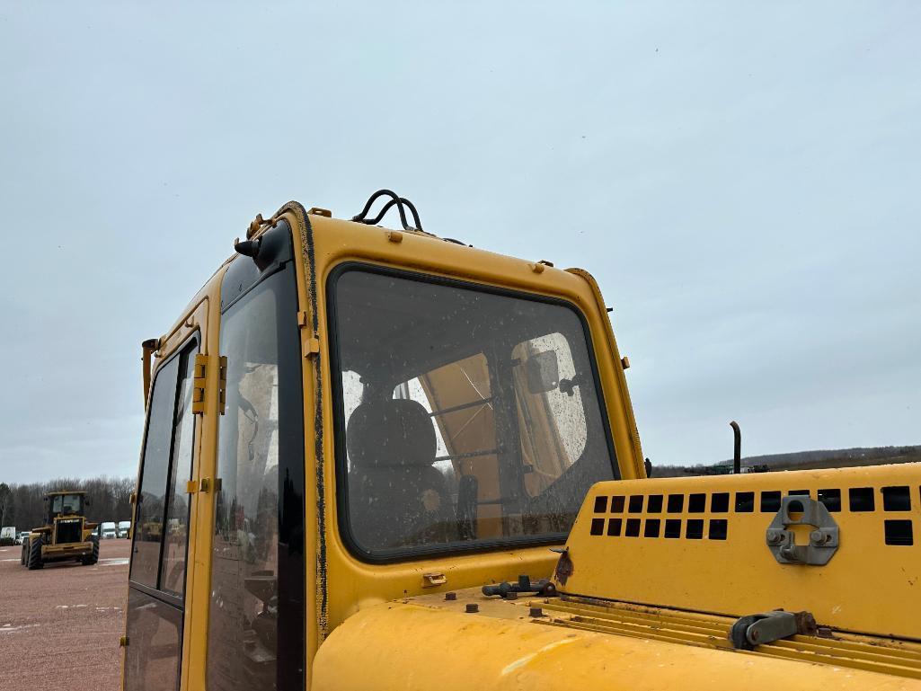 1997 John Deere 120 excavator, cab w/heat, 27 1/2" track pads, 36" bucket, manual thumb, runs &