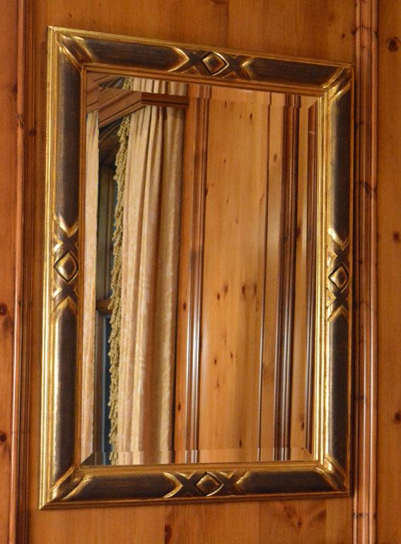 Pair of Ebonized and Giltwood Mirrors