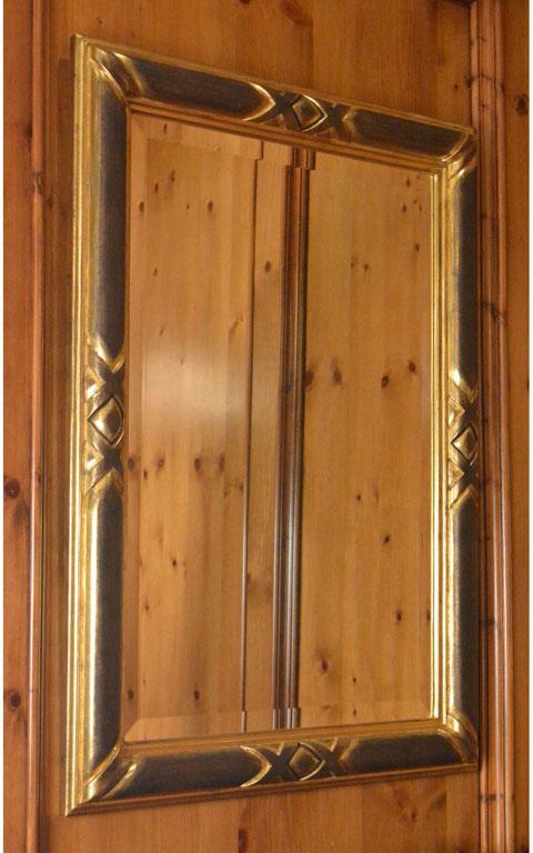 Pair of Ebonized and Giltwood Mirrors