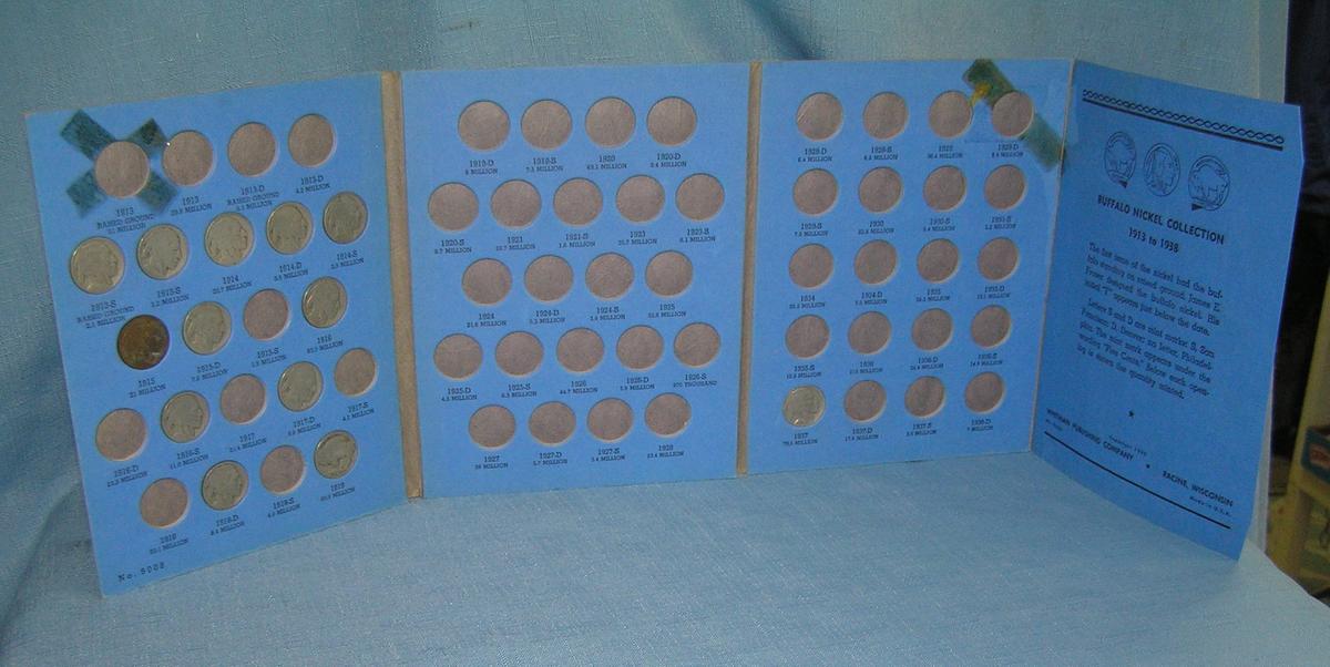 Group of vintage Buffalo nickels in blue book holder