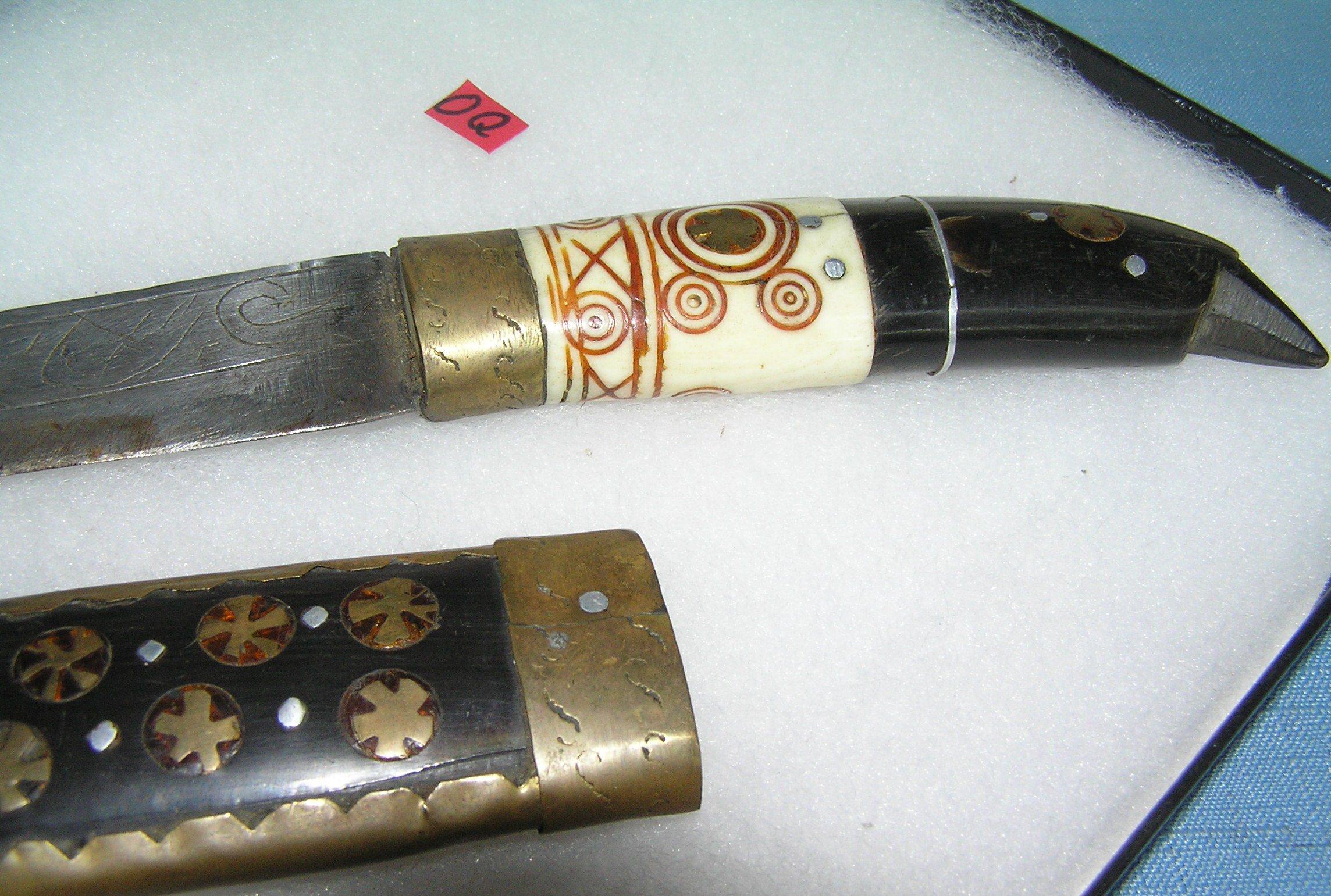 Antique dagger made of bone, brass, walnut and steel