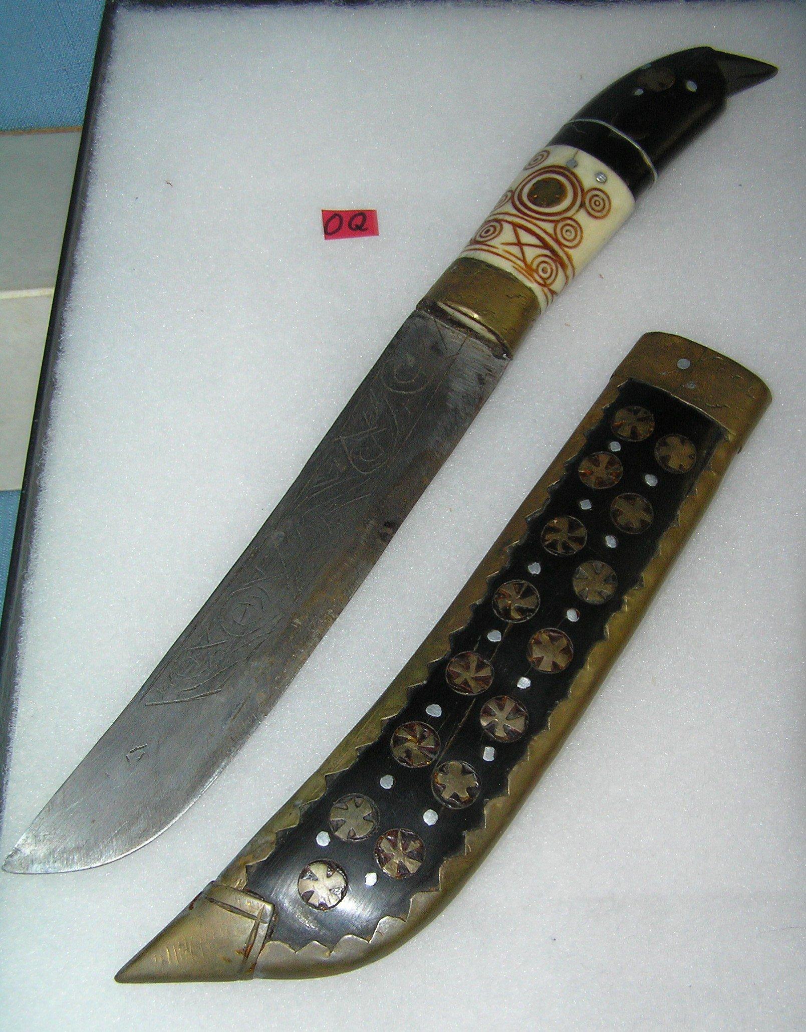Antique dagger made of bone, brass, walnut and steel