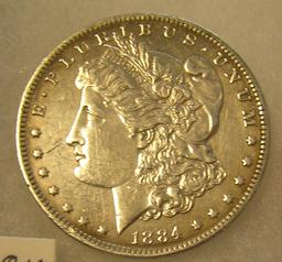 1884-O Morgan silver dollar in AU condition