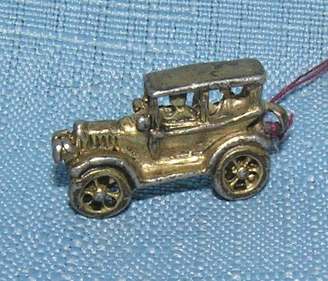 Early cast metal 2 passenger sedan miniature toy car