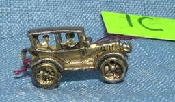 Early cast metal 2 passenger sedan miniature toy car