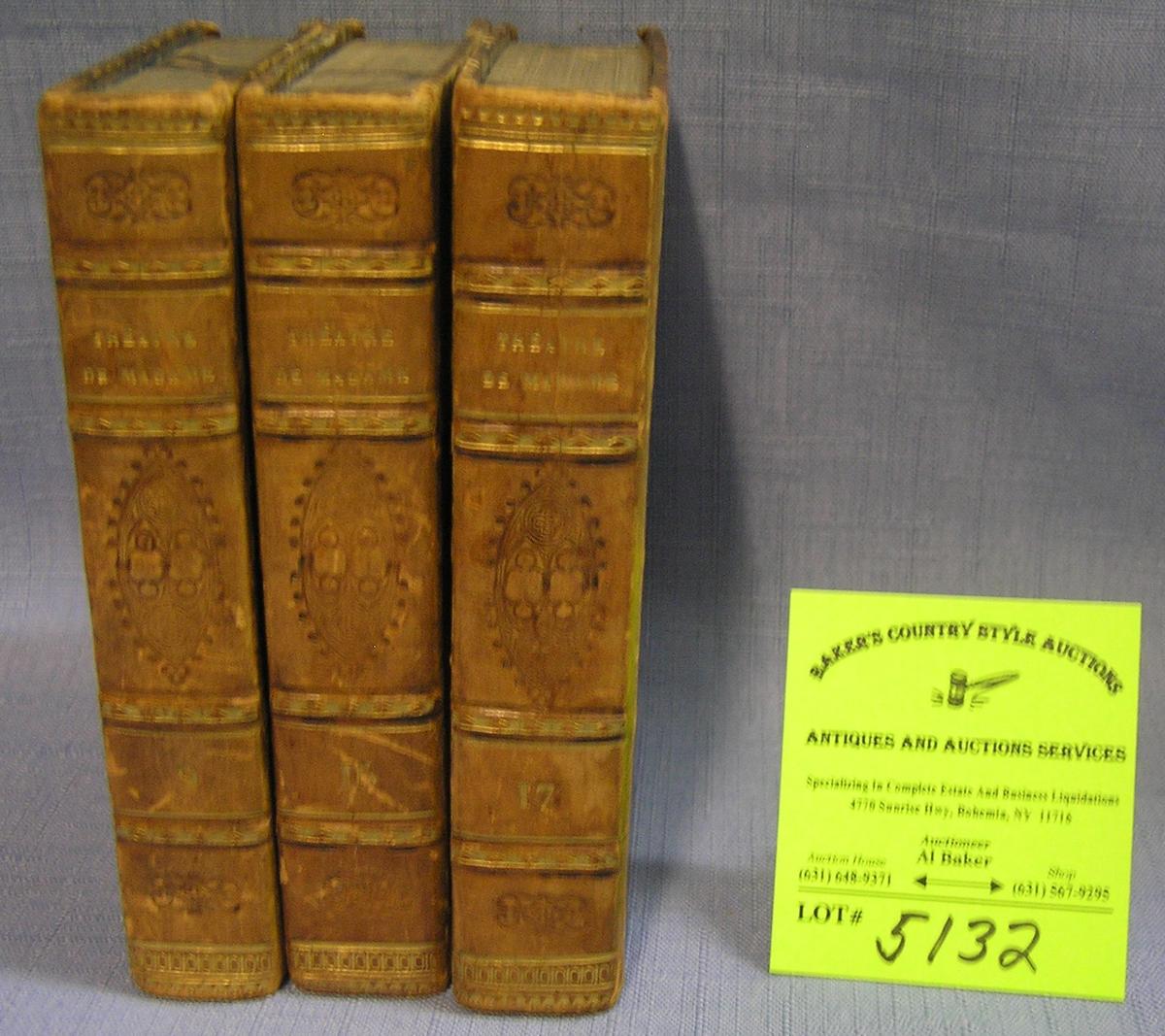 Group of three antique leather bound books