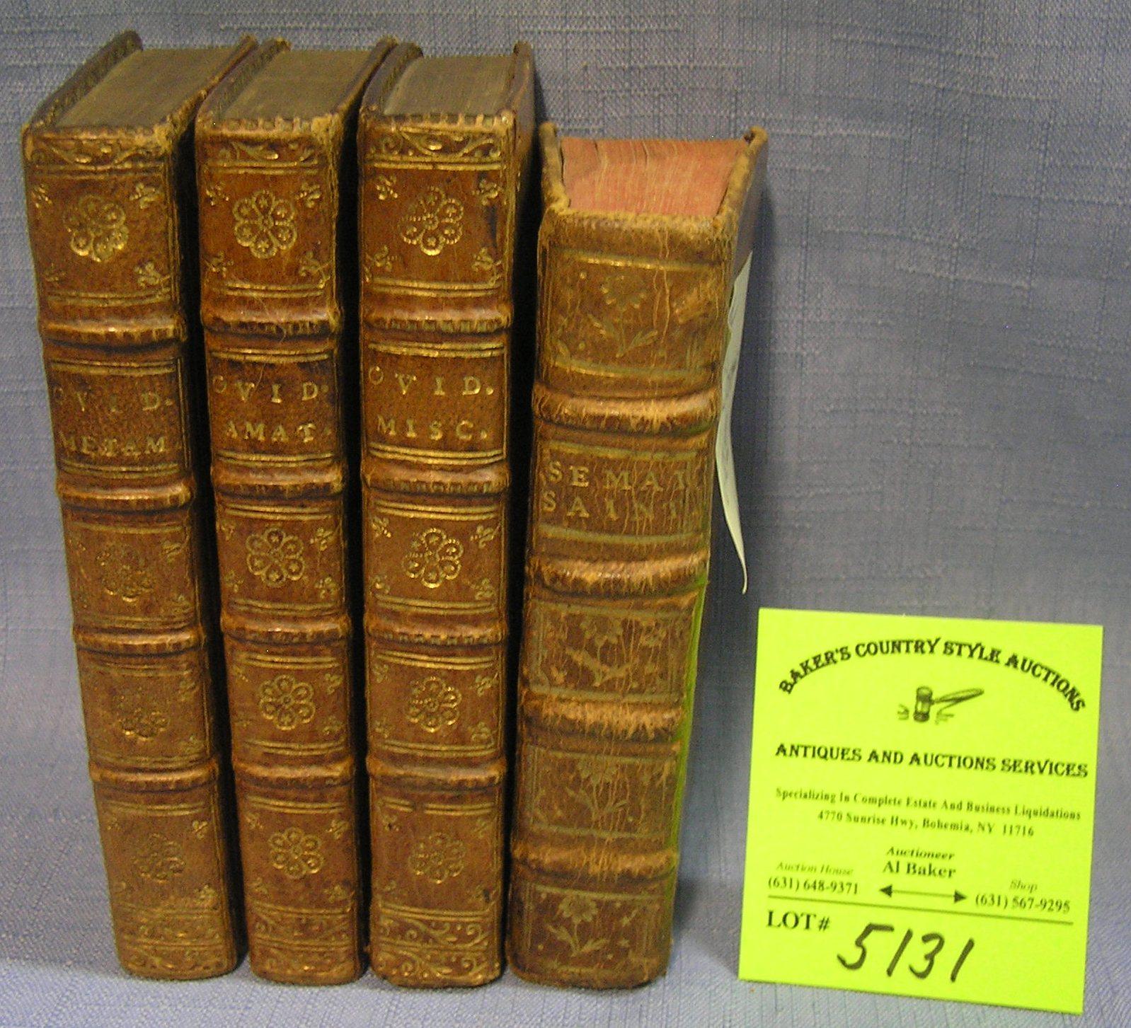 Group of four antique leather bound books